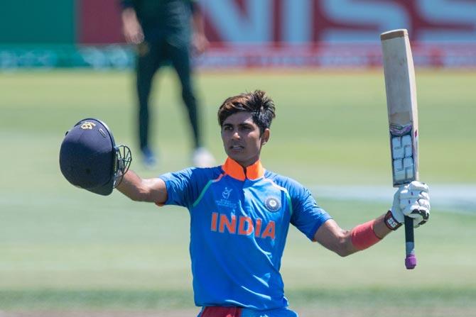 Indias Shubman Gill celebrates 100 runs during the U19 semi-final cricket World Cup match between India and Pakistan at Hagley Oval in Christchurch on January 30, 2018. / AFP