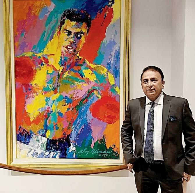 Indian cricket legend Sunil Gavaskar stands with a Muhammad Ali painting in Louisville, USA, last October