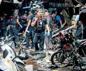 Motorcycle bomb at pork stall in Thai market kills 3