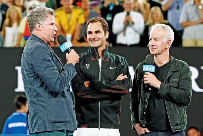 Will Ferrell (left) and John McEnroe (right) interview Roger Federer in Melbourne yesterday. Pic/ Getty Images