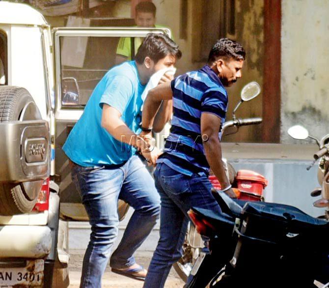 When the journalists saw cops bring in a man covering his face with a handkerchief, they assumed it was Yug Pathak and chased him to the courthouse