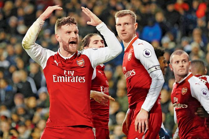 Arsenal players celebrate a goal against West Brom during an EPL tie last December. pic/Getty Images