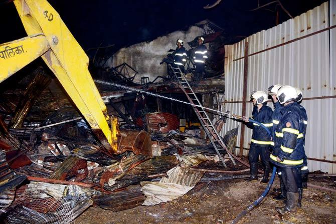 Firefighters douse the flames at the manufacturing unit in Marol