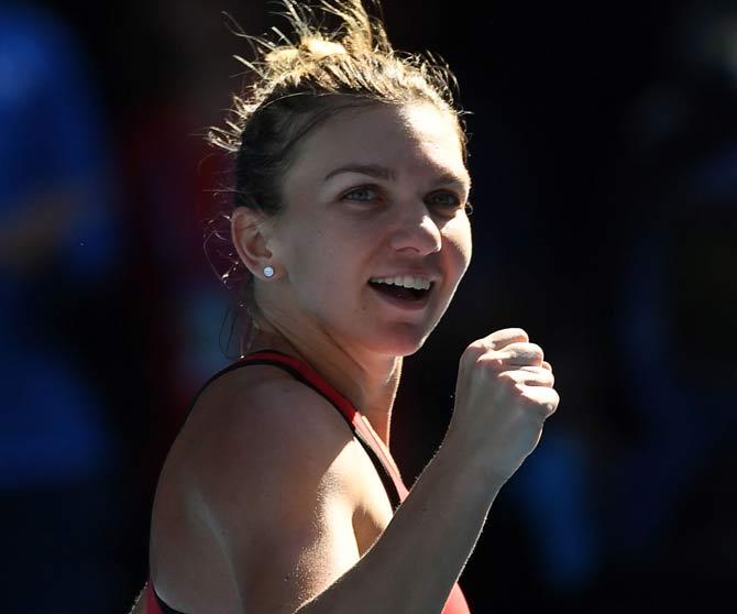 Simona Halep celebrates beating Karolina Pliskova in women