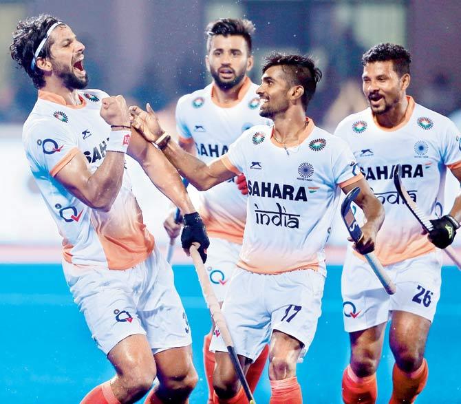 India players celebrate after a goal against England during the Hockey World League Final in Bhubaneswar last year. Pics/ PTI, Getty Images