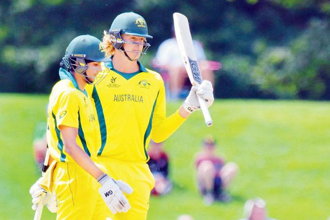 Australias Jack Edwards (right) celebrates his half-century against Afghanistan during the U-19 World Cup semi-final yesterday. pic/AFP