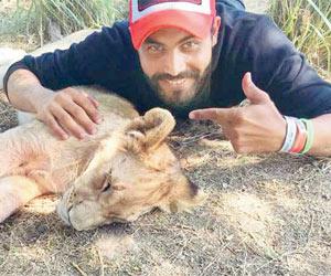 This image of Ravindra Jadeja with a lion cub is adorable