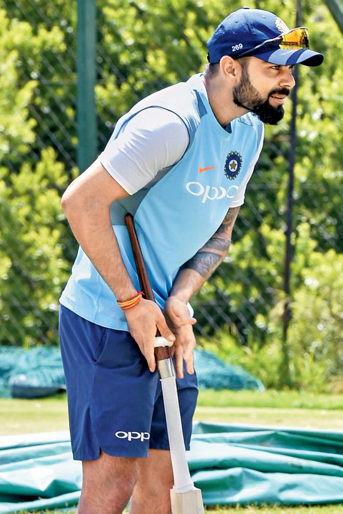 India skipper Virat Kohli checks the grip of his bat during a training session on the eve of the third and final Test against SA in Johannesburg yesterday. Pic/AFP