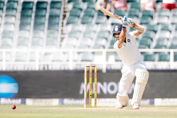 Cheteshwar Pujara drives one en route his 50 on Day One of the third and final Test against South Africa in Johannesburg yesterday. Pic/AFP