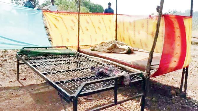 A makeshift tent outside a home