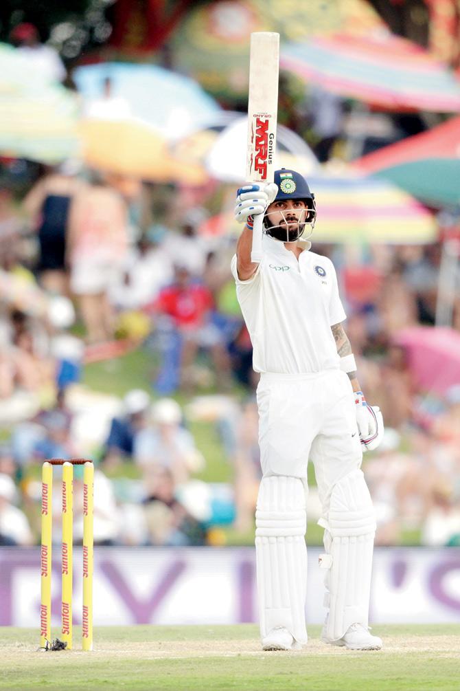 India captain Virat Kohli raises his bat to celebrate his half century during the second day of the Centurion Test against South Africa yesterday. PIC/AFP