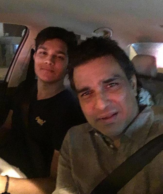 Sanjay Manjrekar in the passenger's seat while his son Siddharth is driving. Sanjay captioned the photo, 'Various stages of parenting. Now it's sitting next to son while he drives.'