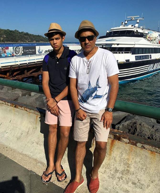 In picture: Sanjay Manjrekar with his son on vacation, posing in front of a beautiful yacht