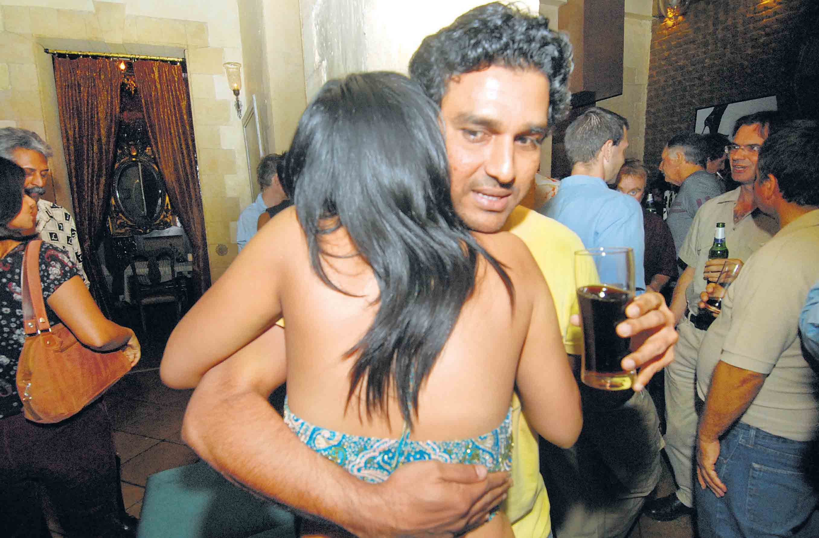 Sanjay Manjrekar and Mandira Bedi celebrate the success of Extra Innings during the ICC Champions Trophy 2006 at Taxi restaurant, Colaba, Mumbai
