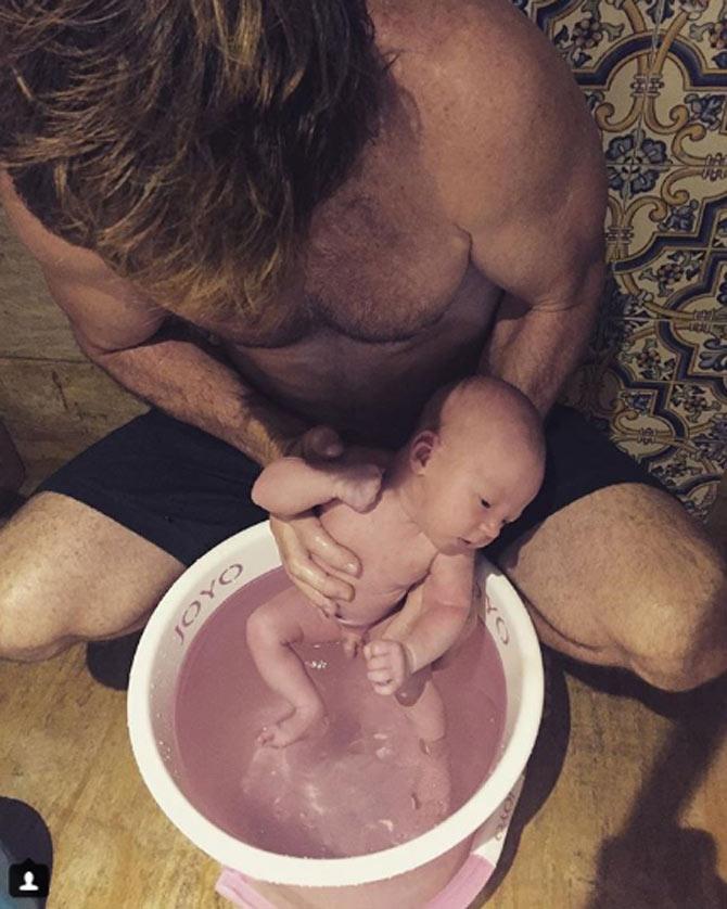 One of the first pictures of Nathan Rhodes posted by Jonty, he captioned 'Nathan feeling 'at home' in the bucket after 10 months in the womb #waterbirth #lifeontour #travelingwithkids#earthmother #championwife #fatherson#midwifemumbai #lodhadham #ayuverda#naturalhealth 