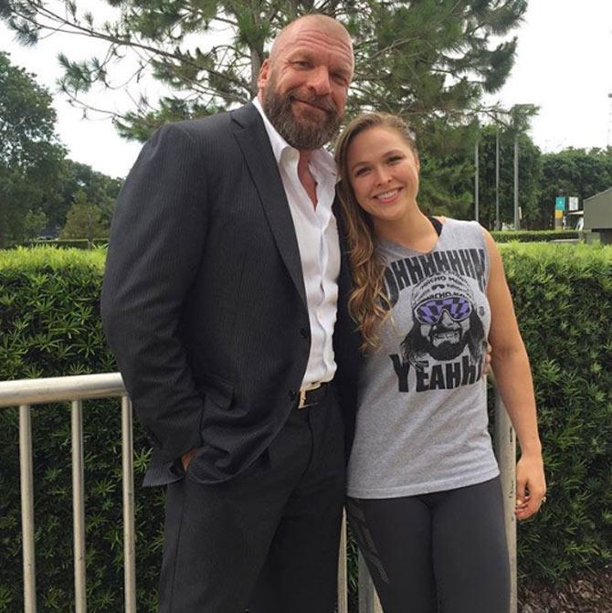 Triple H has performed under various in-ring personas such as Hunter Hearst Helmsley, Jean-Paul Levesque, Terra Ryzing, Terra Risin' and Terror Rising. In picture: Triple H with female mixed martial arts star and WWE wrestler Ronda Rousey