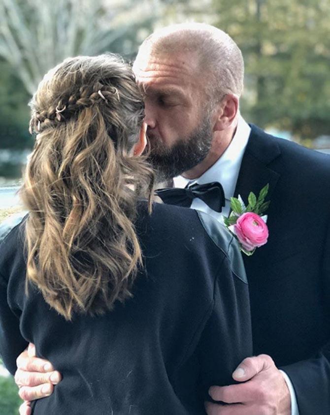 Triple H is a 14-time WWE world heavyweight champion. His list of titles is third highest only behind Ric Flair and John Cena. Triple H, who has three daughters with Stephanie McMahon, posted this picture with a caption, I've been fortunate to do a lot of amazing things in my life. Nothing compares to moments like this...#MyLittleGirl #DaddyDaughterDance #Proud