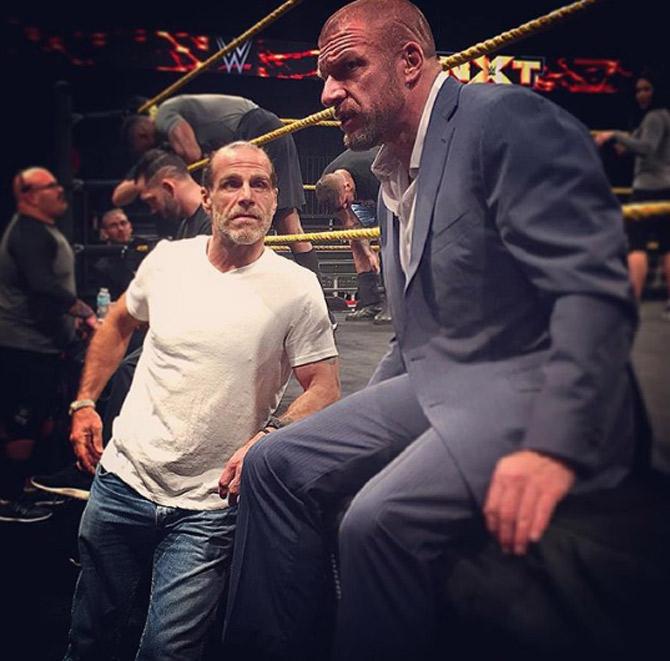 Shawn Michaels is often seen behind the scenes helping Triple H produce WWE NXT events. Triple H captioned this picture as 'Had some extra help today preparing for tonight's episode of @wwenxt...'