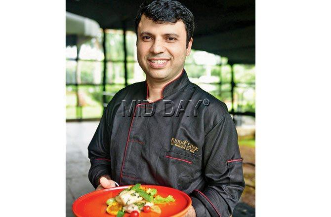 Chef Amit Bajaj with the orange and basil marinated grilled rawas