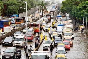 Mumbai rains: Chaos on roads as train services shut down