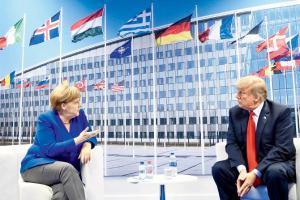 Donald Trump in new war of words with Angela Merkel