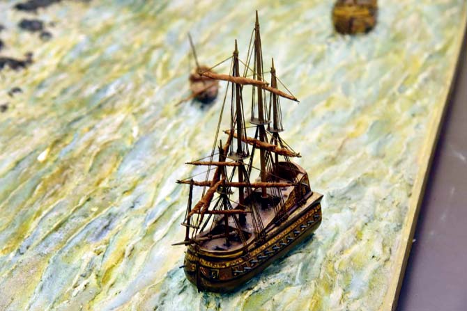 A life-size vessel, which is part of the diorama that depicts a maritime scene from around 170 years ago