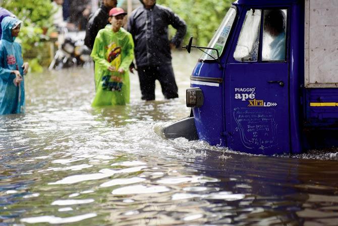 A waterlogged road near Vandana Cinema, Thane. Pics/Sameer Markande