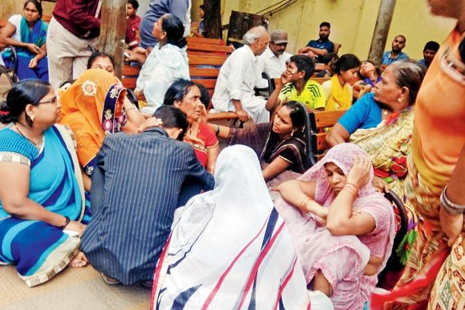 Family members and relatives of the deceased outside Sion hospital