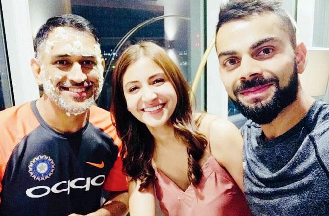 Virat Kohli and wife Anushka are all smiles as they pose with the birthday boy