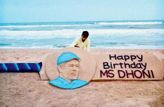 Renowned sand artist Sudarshan Pattnaik tweeted his creation (right) and wrote: My SandArt at puri beach with message #HappyBirthdayMSDhoni wish you a successful life, Great year ahead.