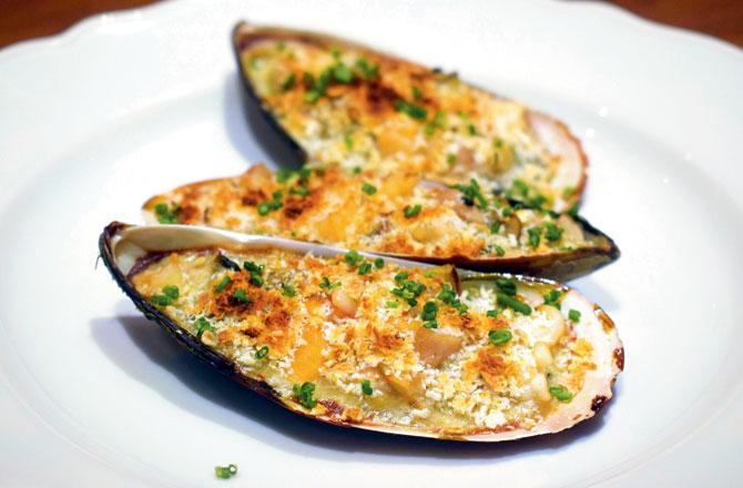 Moules Gratinèes a la Dieppoise: This dish comes from the north of France. Prawns, mussels and salmon are mixed in white sauce and topped with crunchy bread crumbs, and baked.