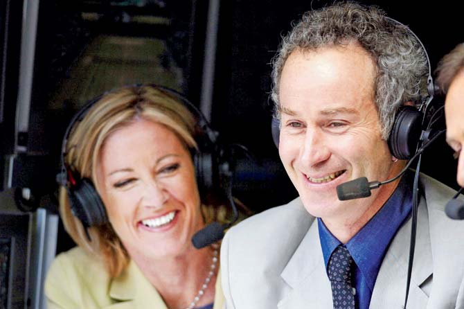 Tennis greats Chris Evert and John McEnroe share a light moment in the commentators box during the 2002 Wimbledon Championships