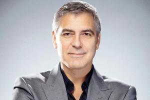 George Clooney walks unassisted after scooter crash