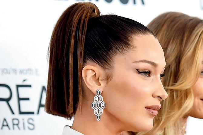 Model Bella Hadid goes for the extreme pull and keeps her pony sleek. Pics/AFP