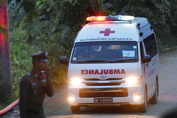 An ambulance exits from the Tham Luang cave area as rescue operations continue for those still trapped inside the cave in Khun Nam Nang Non Forest Park in the Mae Sai district of Chiang Rai province on July 9, 2018. Rescue workers dived deep inside a flooded Thai cave for a second straight day on July 9 in a treacherous bid to save a trapped group of young footballers, with the mission chief promising more "good news" after four of the 13 were saved. Pic/AFP