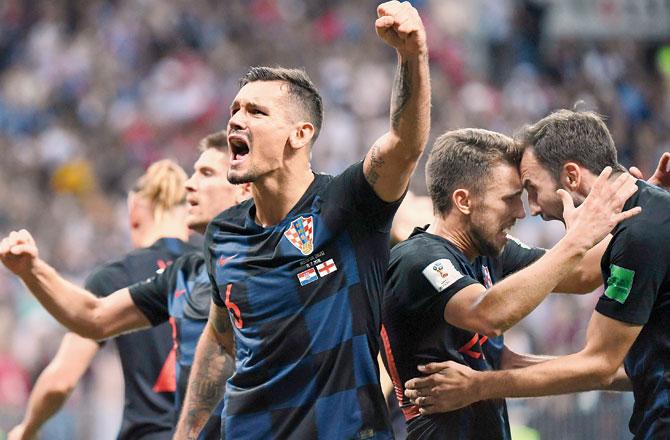 Croatia defender Lovren (centre) celebrates with teammates after the final whistle is blown