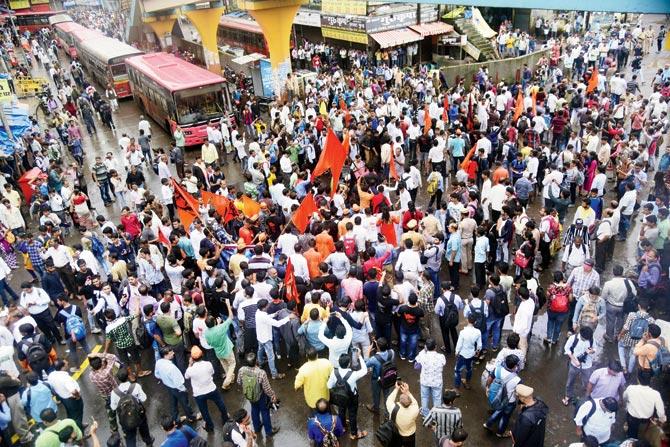 Protesters swarm a bus stand and railway station in Thane