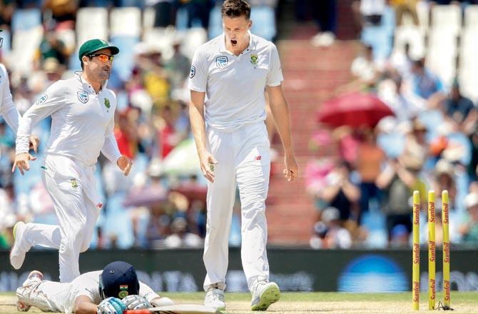 South African bowler Morne Morkel (right) celebrates the dismissal of India