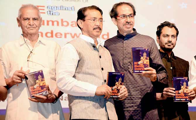 (From left) Madhukar Zende, Isaque Bagwan, Uddhav Thackeray and Nawazuddin Siddiqui at the book release in Bandra last week. Pic/Shadab Khan