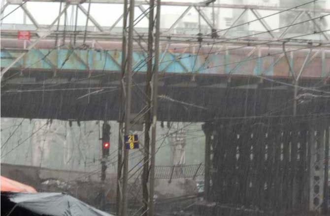 Mumbai Rains: Part of Andheri bridge collapses, train services suspended