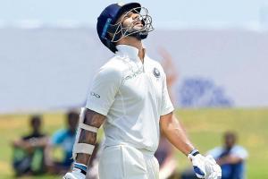 Shikhar Dhawan grabs a pair as India draw against Essex