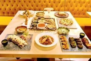 Mumbai Food: Fort's new eatery serves pizza, nachos and risotto in a thali