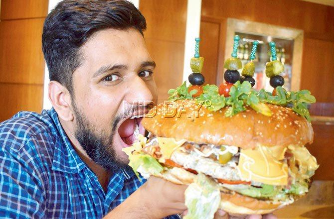 Amrith Padmanand at Juhu’s JW Marriott’s 1 kg burger challenge. Pic/Ashish Raje