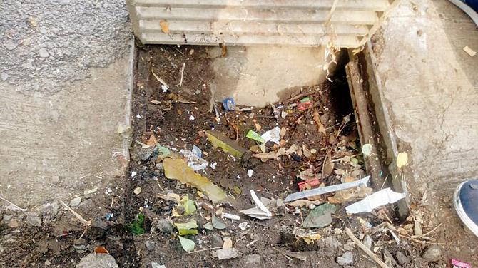 The contractor left heaps of silt on the roadside and it washed back into the drains