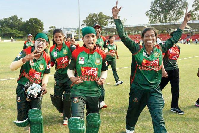 Bangladesh players celebrate their win over India in Kuala Lumpur yesterday