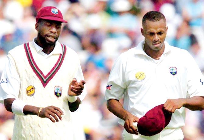 West Indies pacers Curtly Ambrose (left) and Courtney Walsh in August 2000. Pic/AFP