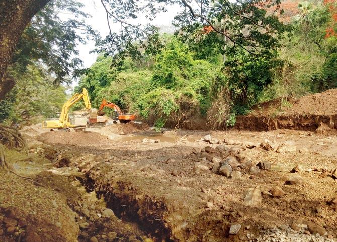 The construction work to build walls along the Dahisar River