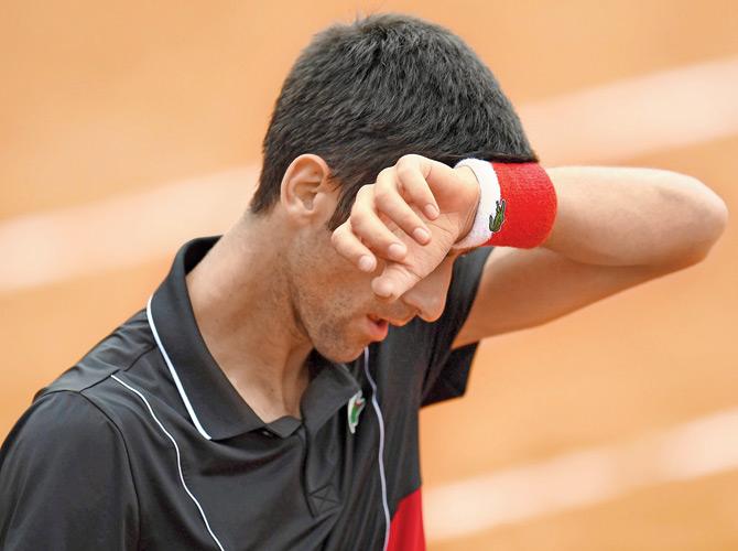 A frustrated Novak Djokovic during his French Open quarter-final against Marco Cecchinato at the Roland Garros yesterday. Pic/AFP
