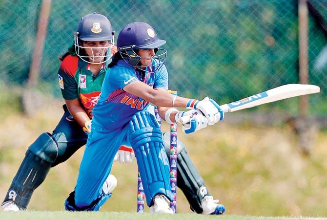 India skipper Harmanpreet Kaur during her 42 against Bangladesh. Pics/Asian Cricket Council facebook page, PTI