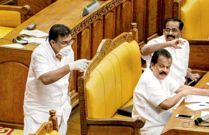 IUML MLA Parakkal Abdullah arrives in the Kerala assembly, wearing a mask and gloves to seek attention of the House towards the outbreak of Nipah virus, in Thiruvananthapuram, on Monday. Pic/PTI
